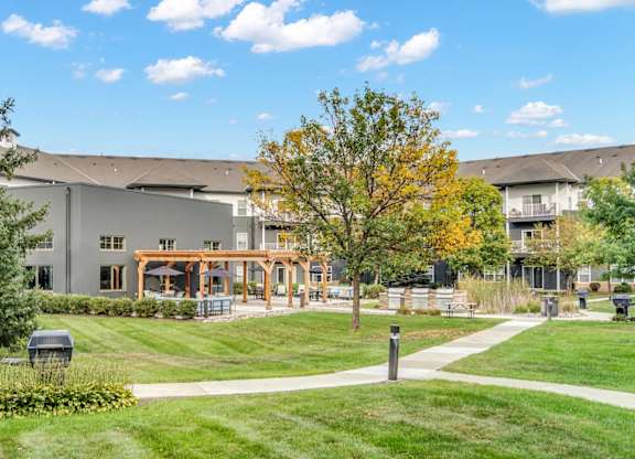 A large building with a grassy area in front of it.