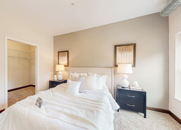 a bedroom with a bed and nightstand