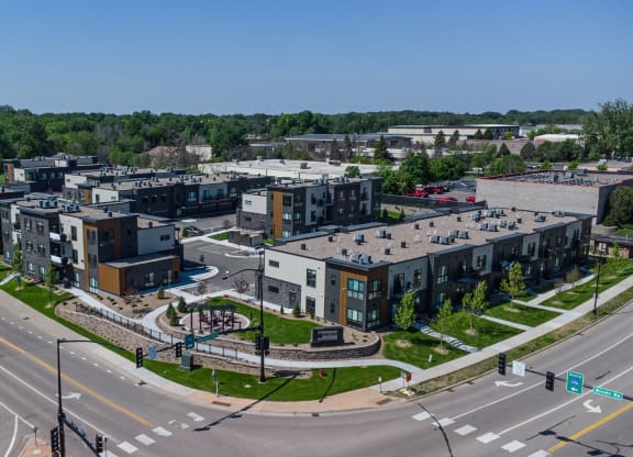 an aerial view of a cluster of buildings on a city street