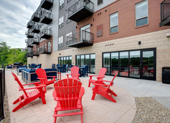 Outdoor patio with grilling and seating at Lake Jonathan Flats, Chaska