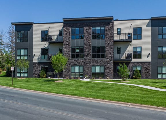 an apartment building on the side of a street