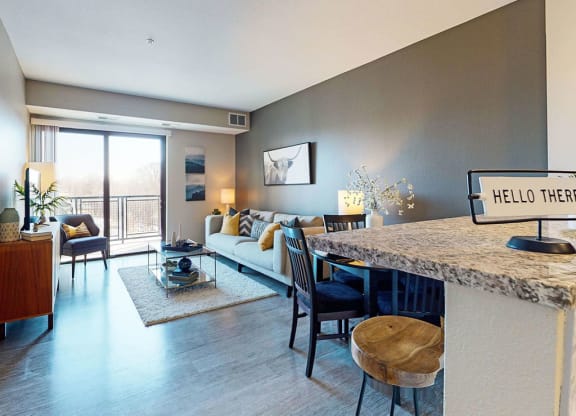 One bedroom apartment, living area with wood-look vinyl plank flooring throughout at The Axis, Plymouth, 55441