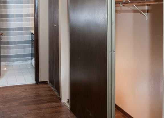 Hardwood Hallway with Large Closets at Dinkytown Apartment
