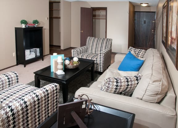 Spacious Living Room with Light Carpet and Front Door Access at 624 Huron Boulevard