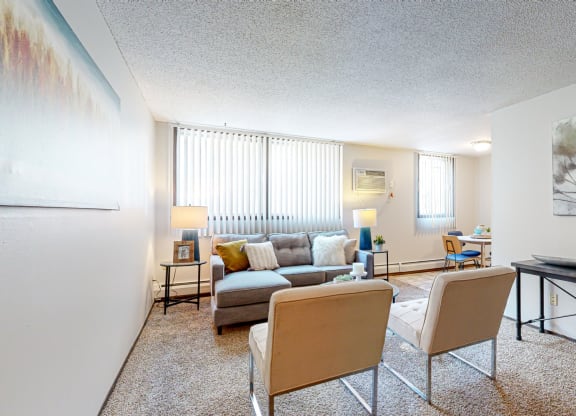 a living room with a couch and two chairs