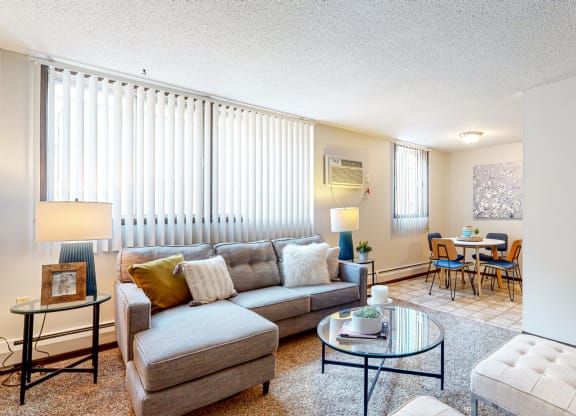 a living room with a couch coffee table and chairs