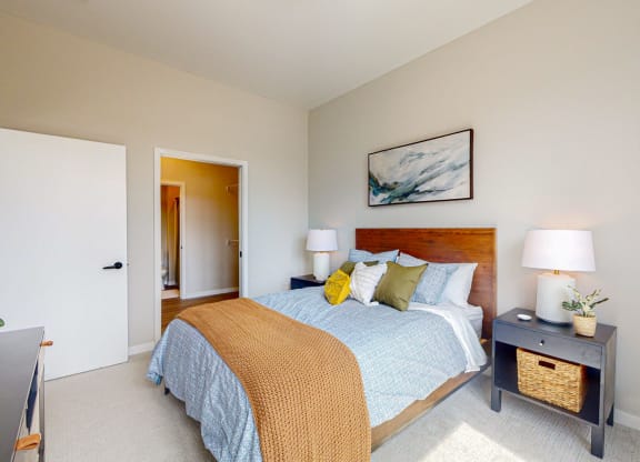 a bedroom with a bed and two night stands