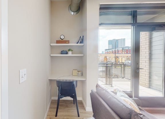 a small desk in the corner of a room