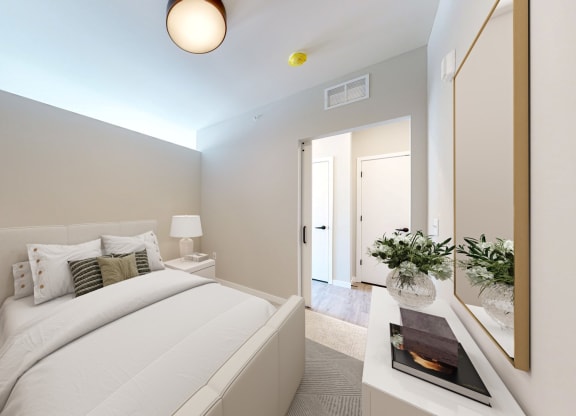 a bedroom with a large bed in a room
