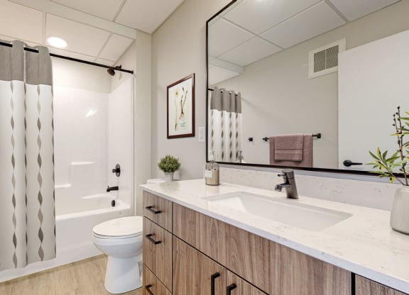 the residence on lamar apartment bathroom with shower and sink