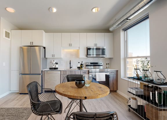 a kitchen and dining area in a 555 waverly unit