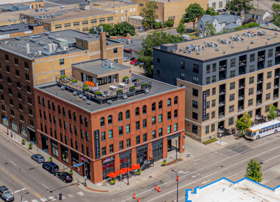 a large brick building with a rooftop terrace