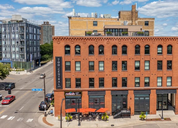 a red brick building with a black sign that says radisson on the side of it