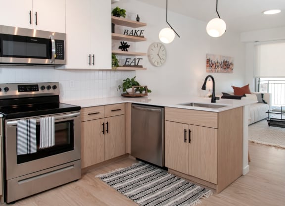 Fully Equipped Kitchen Includes Frost-Free Refrigerator, Electric Range, & Dishwasher at CityLine Apartments, Minnesota, 55406