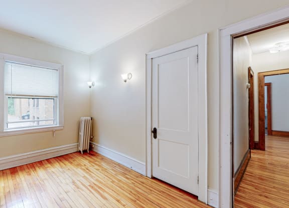 Sibley_3br_bedroom 1 with closet and hardwood floors