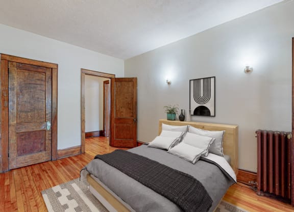 a bedroom with a bed and two doors