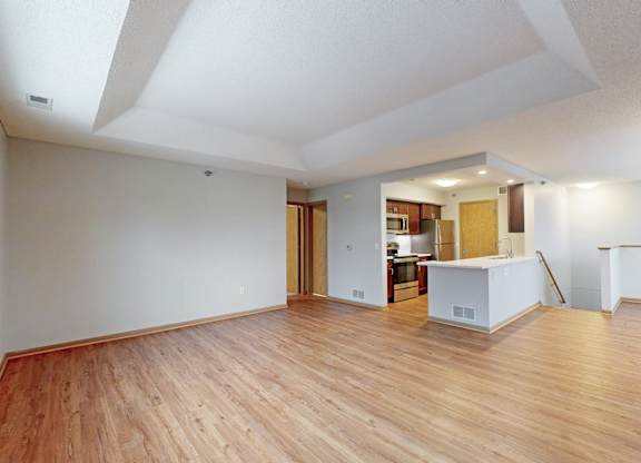 A room with wooden floors and white walls.