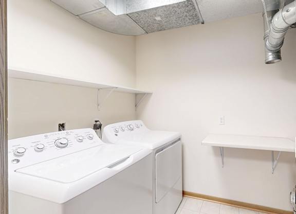A laundry room with a washer and dryer.