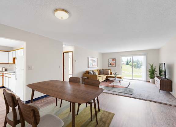 A dining room with a table and chairs is shown.