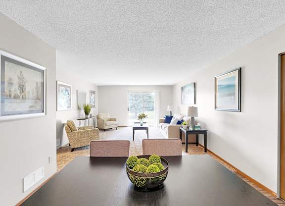 A living room with a brown table and chairs.