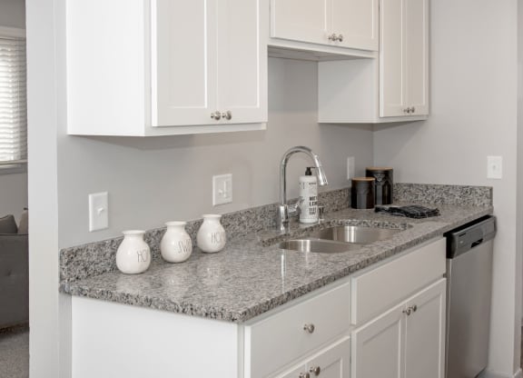 new white cabinetry, granite countertops, full appliance package
