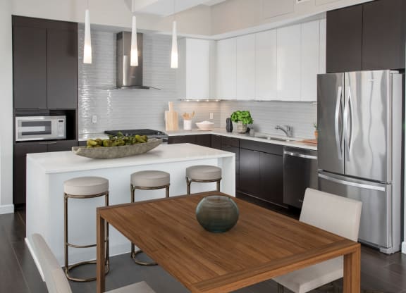 Kitchen with dining area at Custom House penthouse, St Paul