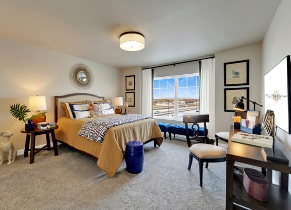 a bedroom with a bed and a window