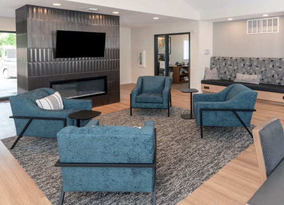 a living room filled with furniture and a fire place