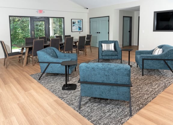 a living room filled with furniture and a large window
