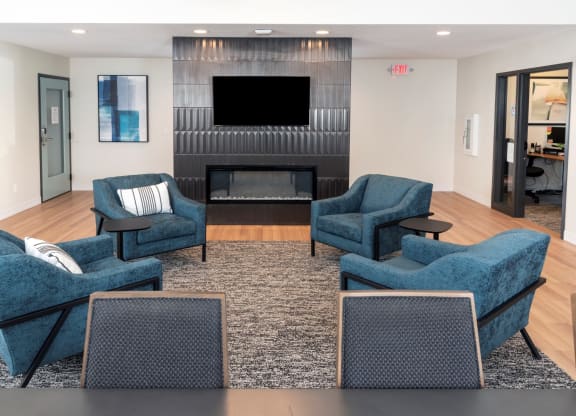 a living room filled with furniture and a fire place