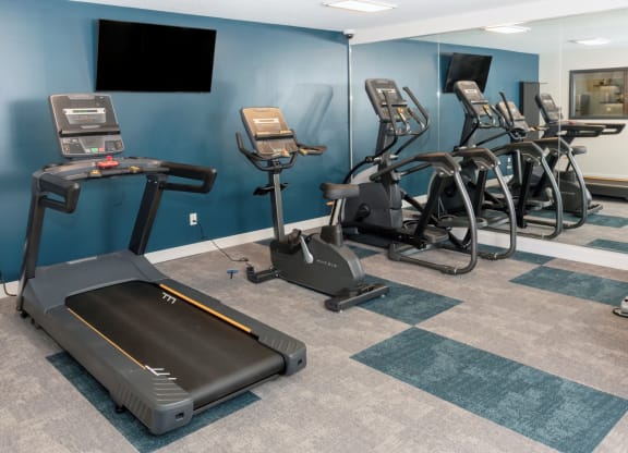 a room filled with lots of exercise equipment