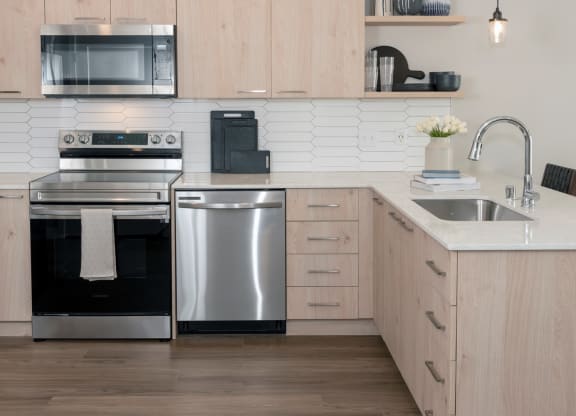Electric Range In Kitchen at Grove80 Apartments, Cottage Grove, MN