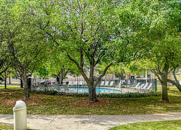 A park with a pool and a bicycle.