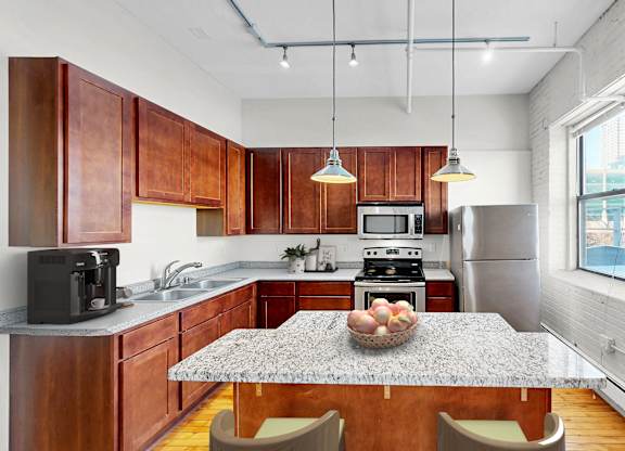A kitchen with wooden cabinets and a granite countertop.