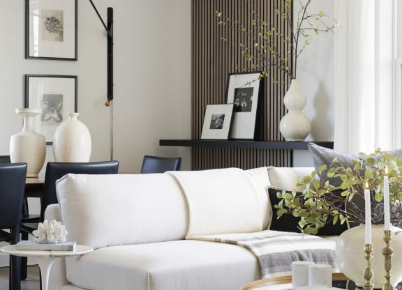 a living room with a white couch and a coffee table