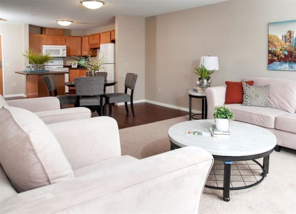 Open Floor Plan Connecting Living Room, Dining Room and Kitchen at Carver Crossing