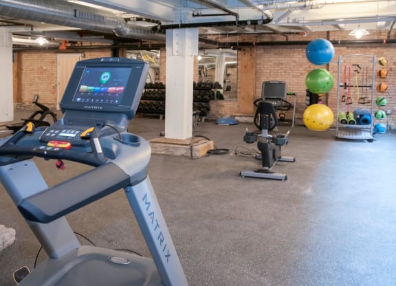 Fitness Center with Multiple Fitness Machines and Materials at 700 Central Apartments, 700 Central Avenue, Minneapolis