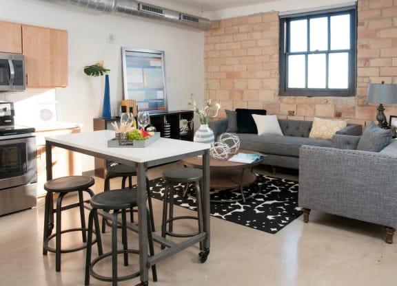 Exposed Brick Wall in Living Room at 700 Central Apartment Unit