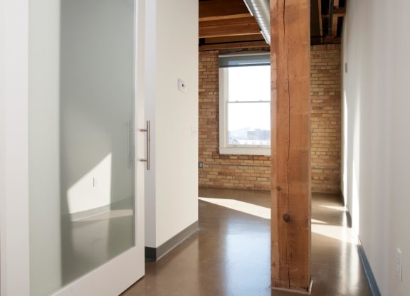 Translucent Sliding Door with White Frame to Entrance of Master Bedroom at Minneapolis MN Apartment