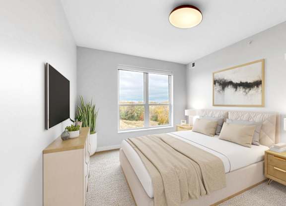 A bedroom with a large bed, a flat screen TV, and a window overlooking the ocean.