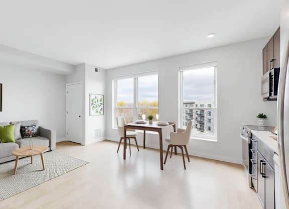 A modern living room with a grey couch and a wooden coffee table.