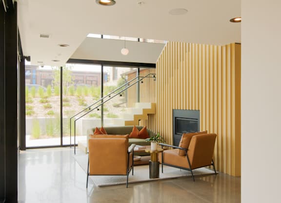 A living room with a fireplace and a sofa.