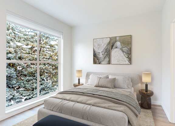 A bedroom with a large bed and a painting on the wall.