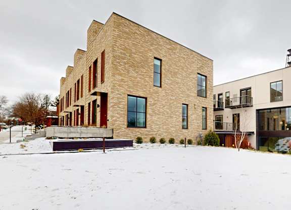A modern house with a flat roof and large windows.