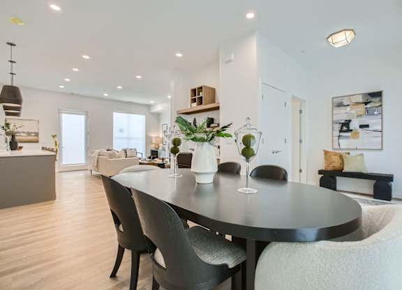 a dining room with a table and chairs at One West Drive Apartments, Excelsior, Minnesota
