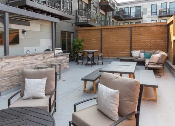 A patio with a table and chairs.
