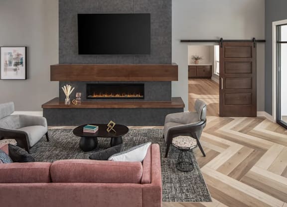 Clubroom With Fireplace And TV at The Edison at Maple Grove, Maple Grove, 55311