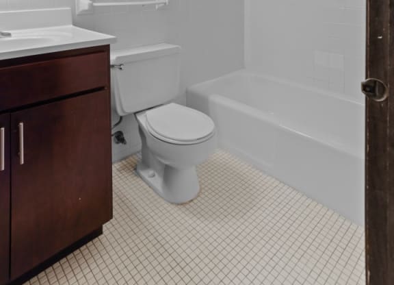 a bathroom with a toilet sink and bathtub