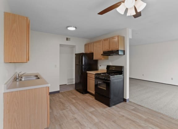 a kitchen and living room in a 555 waverly unit