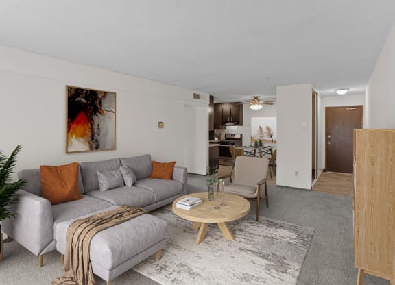 a living room with a couch coffee table and chairs